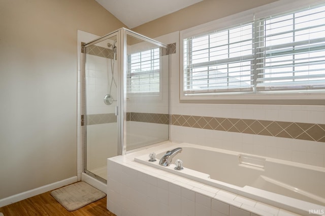 2007 Kingfisher Dr, Lafayette, IN 47909 - bathroom with a garden tub, a stall shower, and wood finished floors