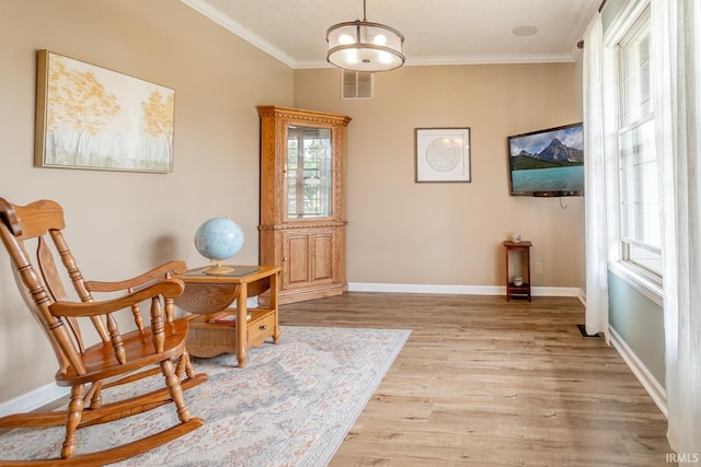 2007 Kingfisher Dr, Lafayette, IN 47909 - living area with crown molding and light wood-style flooring
