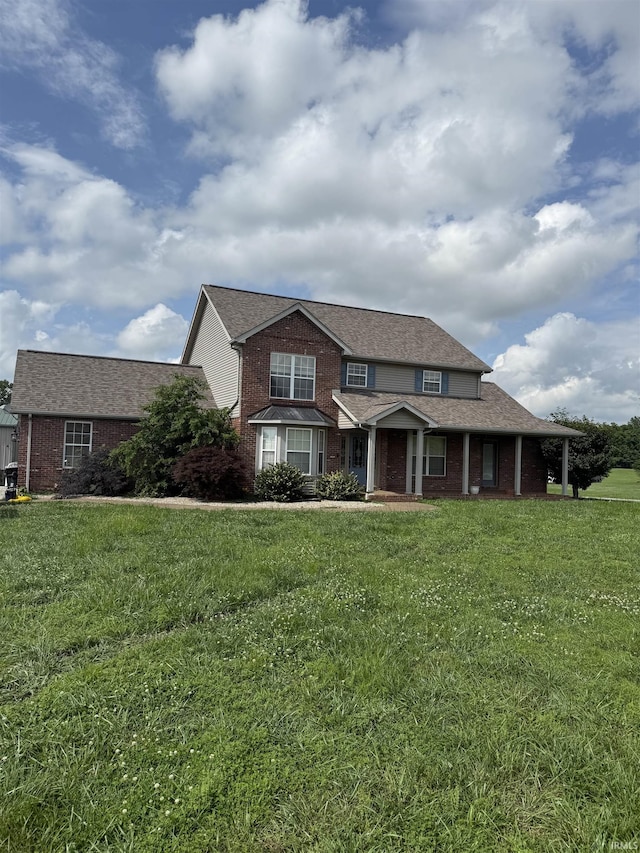 5450 Fox Chase Ct, Boonville, IN 47601 - view of front of house with brick siding, a front lawn, and a porch