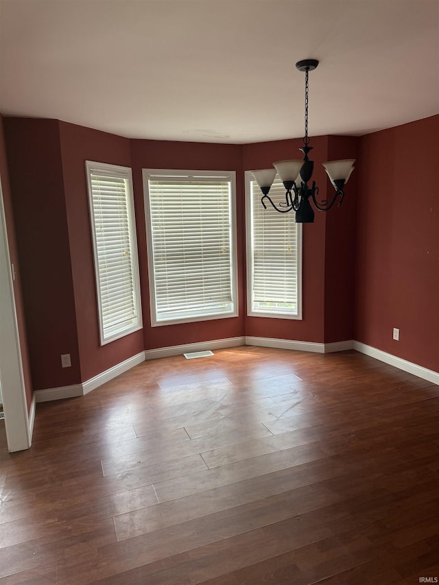 5450 Fox Chase Ct, Boonville, IN 47601 - spare room featuring a chandelier and wood finished floors