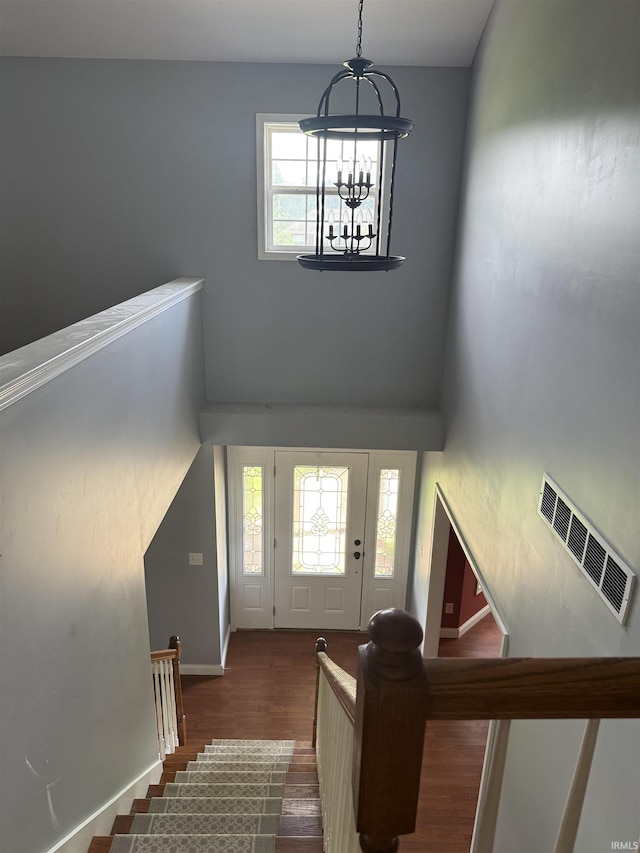 5450 Fox Chase Ct, Boonville, IN 47601 - entrance foyer featuring a chandelier, wood finished floors, a high ceiling, and stairway