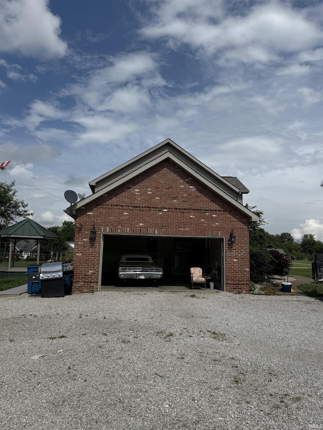 5450 Fox Chase Ct, Boonville, IN 47601 - view of side of property with brick siding, driveway, and a gazebo
