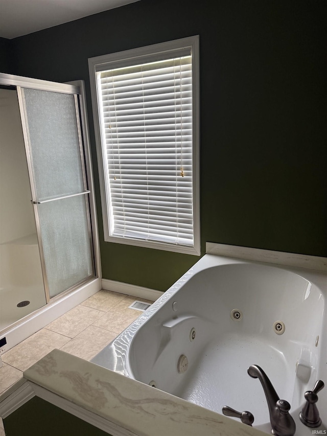 5450 Fox Chase Ct, Boonville, IN 47601 - bathroom with a shower stall, a tub with jets, and tile patterned floors