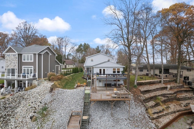 2770 N Baers Ct, Monticello, IN 47960 - rear view of property with stairway, a wooden deck, and a residential view