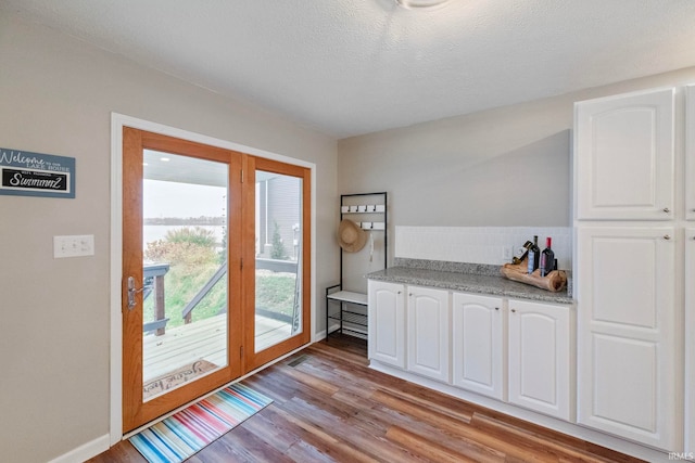 2770 N Baers Ct, Monticello, IN 47960 - doorway to outside with light wood-style flooring and baseboards