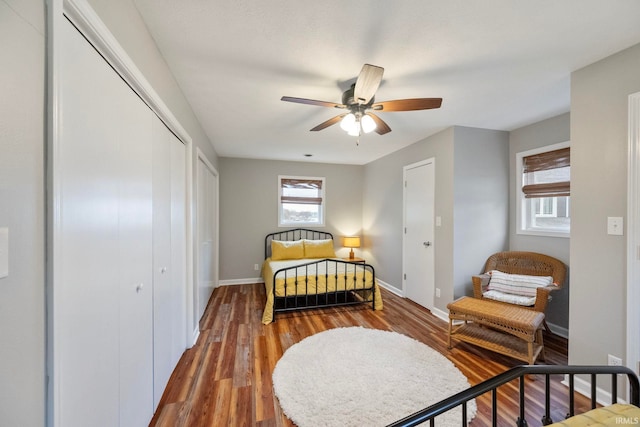2770 N Baers Ct, Monticello, IN 47960 - bedroom featuring wood finished floors, a ceiling fan, and multiple closets