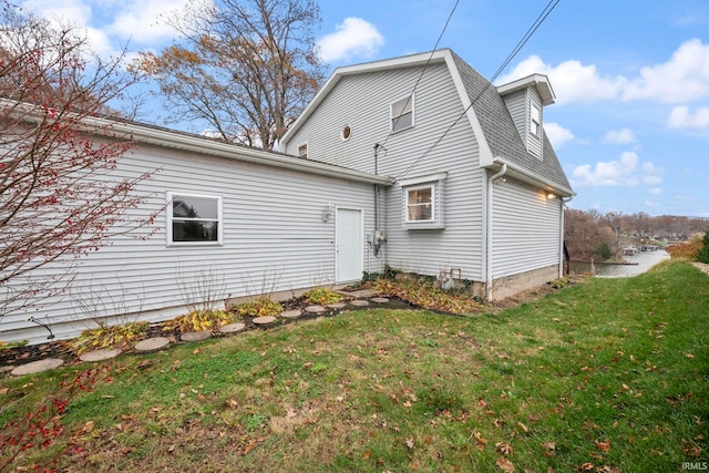 2770 N Baers Ct, Monticello, IN 47960 - rear view of property featuring a lawn and roof with shingles