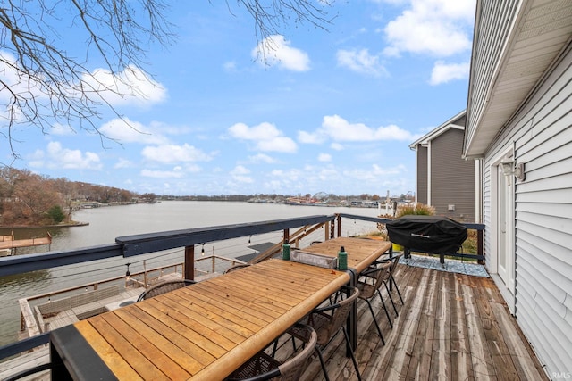 2770 N Baers Ct, Monticello, IN 47960 - wooden deck with outdoor dining area, a water view, and grilling area