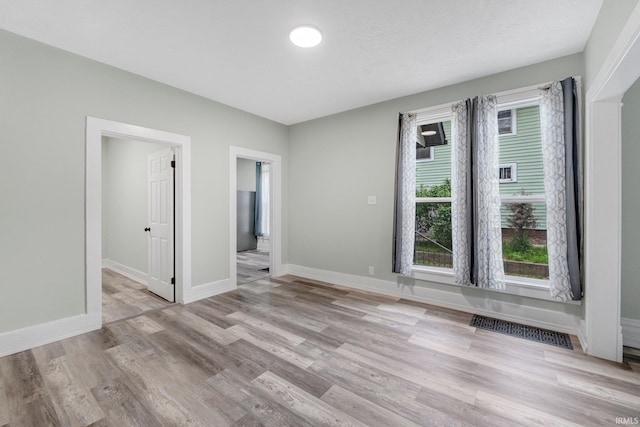 1409 Oakland St, Fort Wayne, IN 46808 - empty room with light wood-style flooring and baseboards