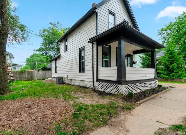 1409 Oakland St, Fort Wayne, IN 46808 - view of side of property with covered porch and a chimney