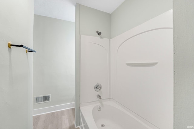 1409 Oakland St, Fort Wayne, IN 46808 - full bathroom featuring wood finished floors and shower / tub combination