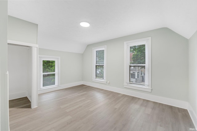 1409 Oakland St, Fort Wayne, IN 46808 - additional living space with lofted ceiling, healthy amount of natural light, and light wood finished floors
