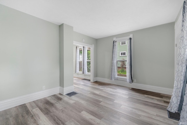 1409 Oakland St, Fort Wayne, IN 46808 - unfurnished room featuring wood finished floors and baseboards