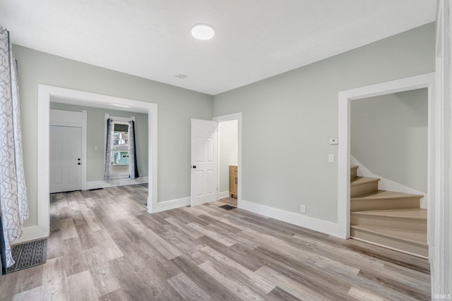 1409 Oakland St, Fort Wayne, IN 46808 - empty room featuring stairs and wood finished floors