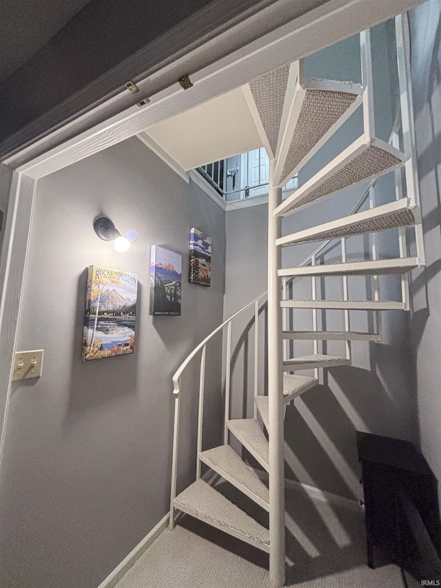 9324 S Lake Ridge Dr Unit 60, Bloomington, IN 47401 - staircase with baseboards and carpet floors