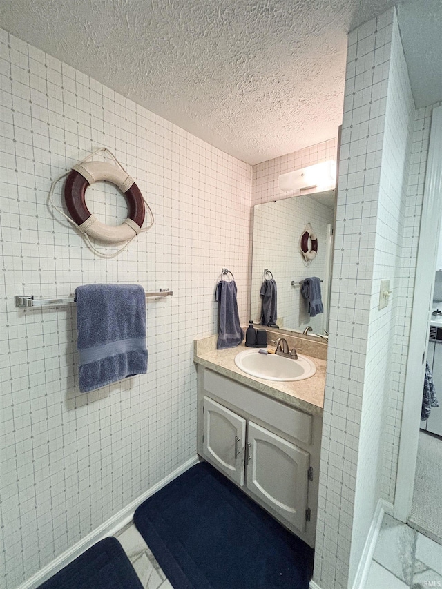 9324 S Lake Ridge Dr Unit 60, Bloomington, IN 47401 - bathroom featuring a textured ceiling and vanity