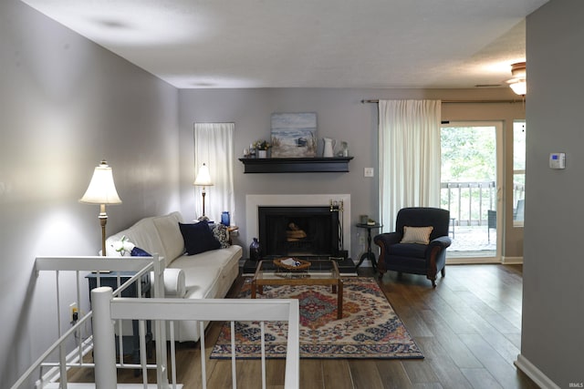 9324 S Lake Ridge Dr Unit 60, Bloomington, IN 47401 - living area featuring wood finished floors and a fireplace