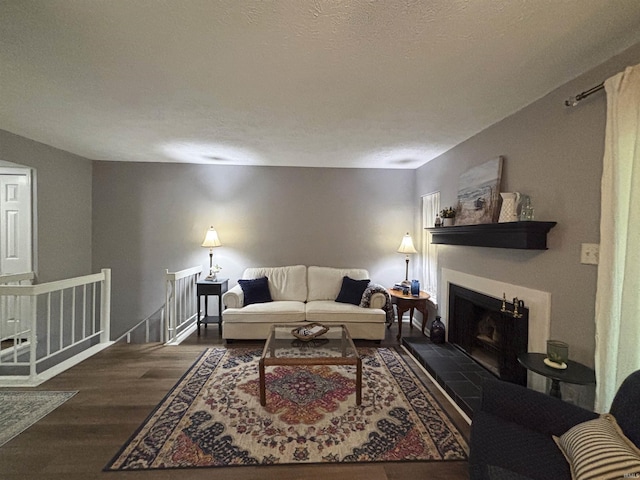 9324 S Lake Ridge Dr Unit 60, Bloomington, IN 47401 - living room with wood finished floors and a fireplace with raised hearth