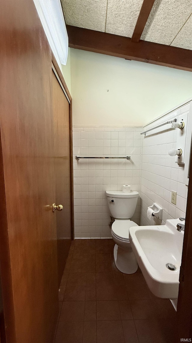 96 Greenwood Retreat Rd, Bedford, IN 47421 - half bath with tile walls, tile patterned flooring, and a wainscoted wall