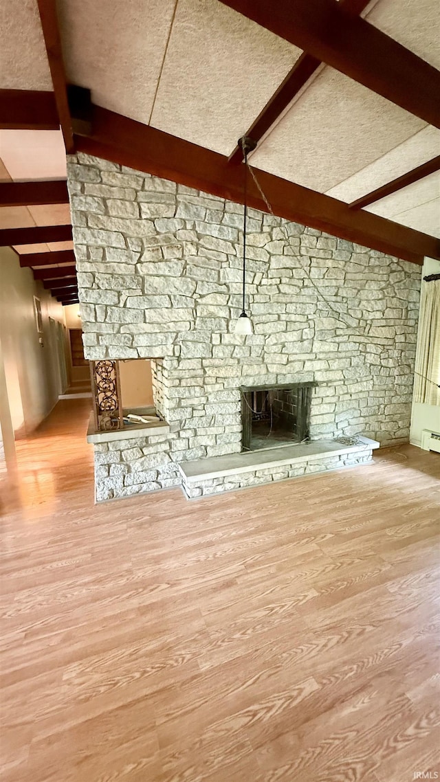 96 Greenwood Retreat Rd, Bedford, IN 47421 - unfurnished living room featuring a stone fireplace and wood finished floors