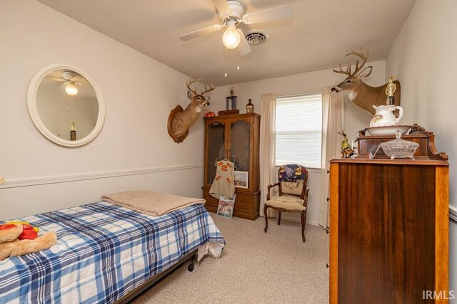 401 Meadow Ln, Hartford City, IN 47348 - carpeted bedroom with a ceiling fan