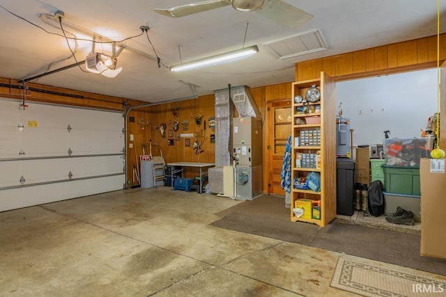 401 Meadow Ln, Hartford City, IN 47348 - garage featuring a garage door opener and heating unit