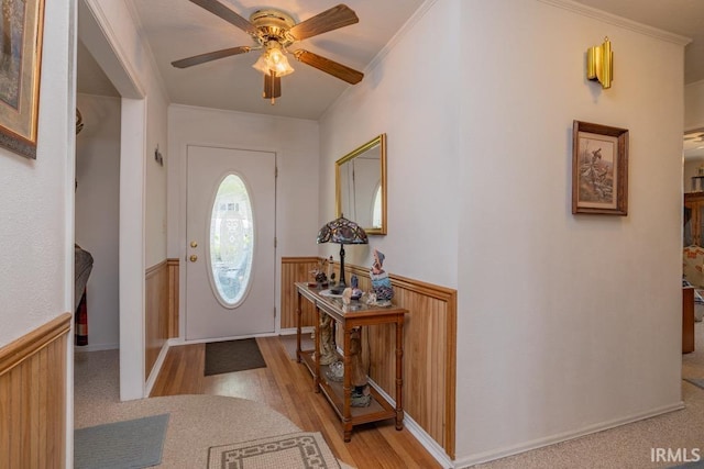 401 Meadow Ln, Hartford City, IN 47348 - entryway with a wainscoted wall, a ceiling fan, light wood-style floors, and ornamental molding