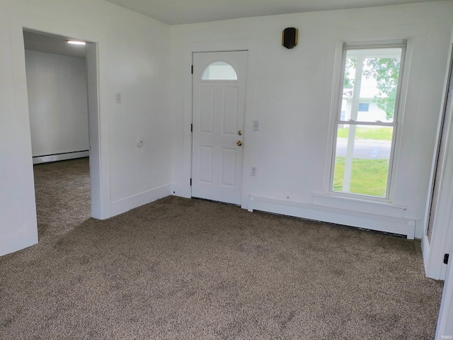 607 W 4th St, North Manchester, IN 46962 - foyer with baseboard heating, carpet floors, and healthy amount of natural light