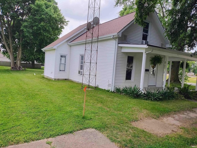 607 W 4th St, North Manchester, IN 46962 - view of side of home featuring a lawn and covered porch