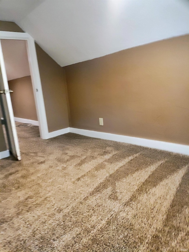 607 W 4th St, North Manchester, IN 46962 - empty room featuring lofted ceiling and carpet flooring