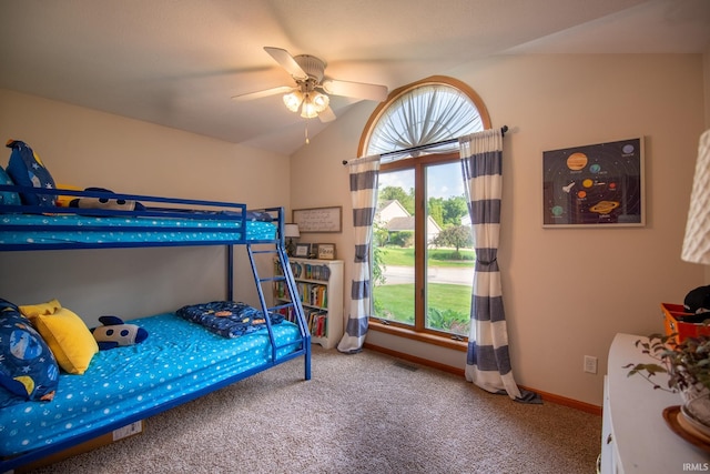 22885 Stonebrier Dr, Elkhart, IN 46514 - carpeted bedroom featuring multiple windows, vaulted ceiling, and a ceiling fan