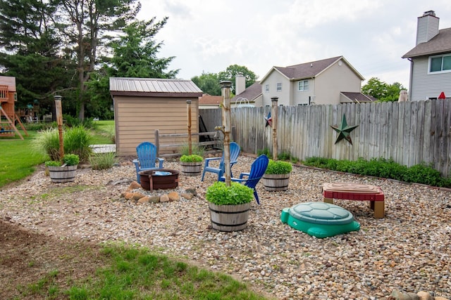 22885 Stonebrier Dr, Elkhart, IN 46514 - fenced backyard with a fire pit and a shed
