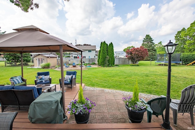 22885 Stonebrier Dr, Elkhart, IN 46514 - fenced backyard featuring a trampoline, outdoor lounge area, a shed, a wooden deck, and a gazebo