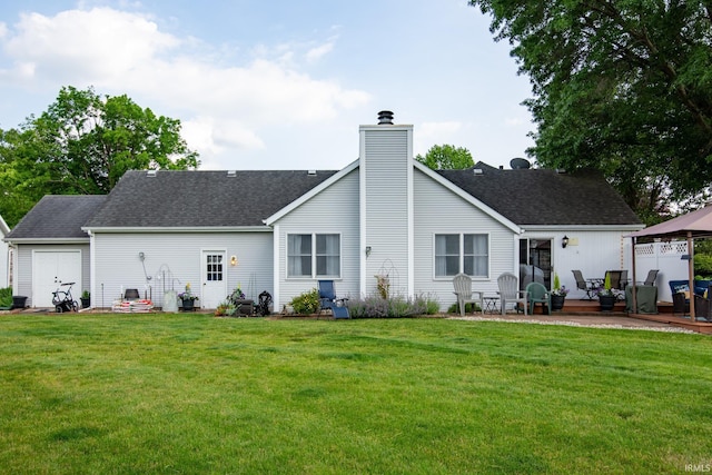 22885 Stonebrier Dr, Elkhart, IN 46514 - back of house featuring a chimney, a yard, and a shingled roof