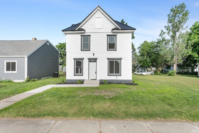 1009 N Adams St, South Bend, IN 46628 - view of front of house featuring a front lawn, a metal roof, and a standing seam roof