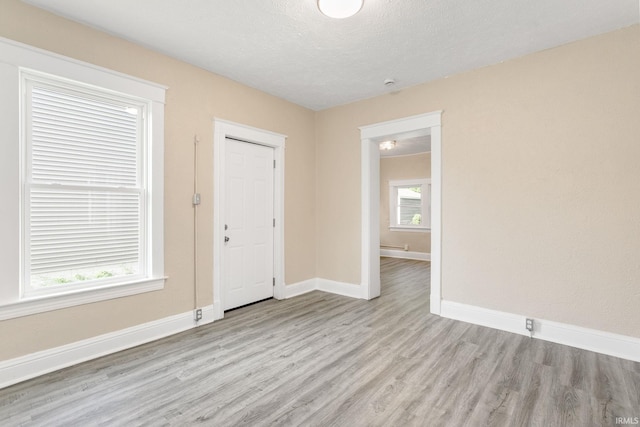 1009 N Adams St, South Bend, IN 46628 - entryway with wood finished floors and a textured ceiling