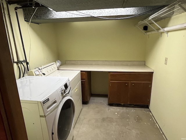 2127 Flora Dr, Peru, IN 46970 - laundry area with washer and clothes dryer and cabinet space