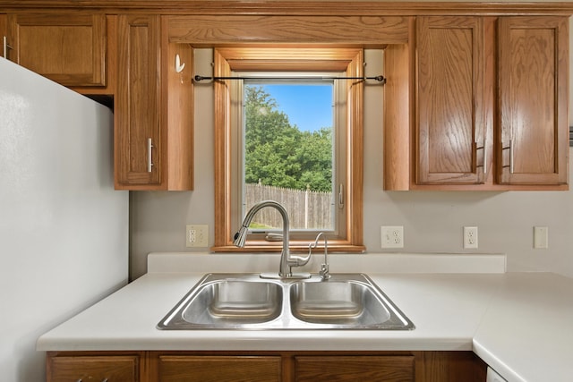 5130 Windy Knoll Ct, Fort Wayne, IN 46809 - kitchen featuring freestanding refrigerator, brown cabinets, and light countertops