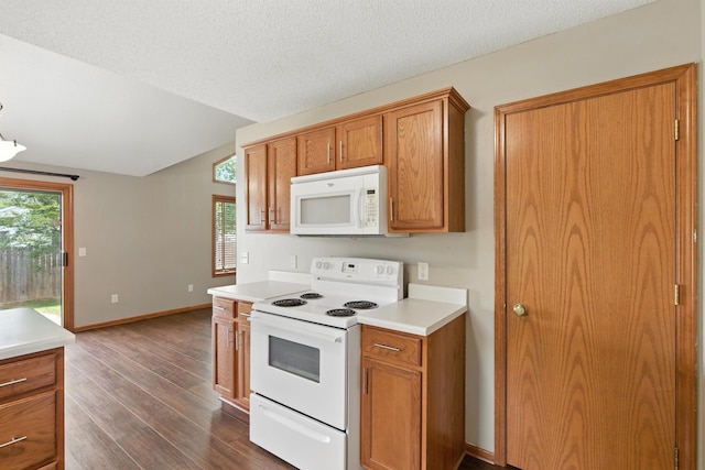 5130 Windy Knoll Ct, Fort Wayne, IN 46809 - kitchen with white appliances, dark wood finished floors, brown cabinets, light countertops, and lofted ceiling