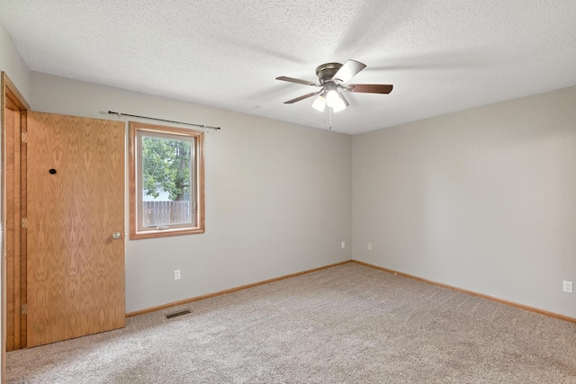 5130 Windy Knoll Ct, Fort Wayne, IN 46809 - spare room featuring carpet flooring, ceiling fan, and a textured ceiling