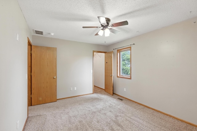 5130 Windy Knoll Ct, Fort Wayne, IN 46809 - unfurnished bedroom with carpet floors, a textured ceiling, and a ceiling fan