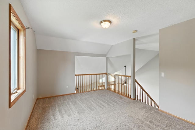 5130 Windy Knoll Ct, Fort Wayne, IN 46809 - carpeted spare room with plenty of natural light, vaulted ceiling, a smoke detector, and a textured ceiling