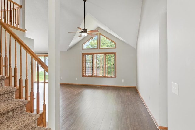 5130 Windy Knoll Ct, Fort Wayne, IN 46809 - unfurnished living room featuring a ceiling fan, stairway, wood finished floors, and vaulted ceiling