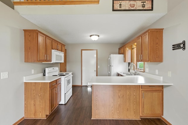 5130 Windy Knoll Ct, Fort Wayne, IN 46809 - kitchen with white appliances, light countertops, a peninsula, dark wood-type flooring, and brown cabinets