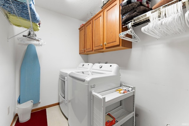 11301 Clarendon Pass, Fort Wayne, IN 46845 - laundry area with separate washer and dryer, cabinet space, and light flooring
