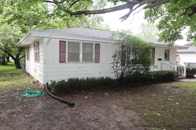 310 W Elm St, Millersburg, IN 46543 - view of front of house with a shingled roof