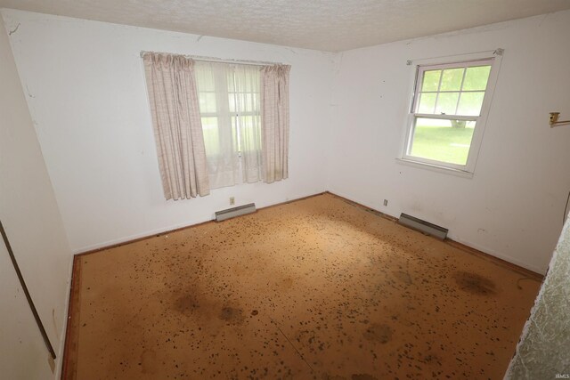 310 W Elm St, Millersburg, IN 46543 - spare room featuring baseboard heating and a baseboard radiator