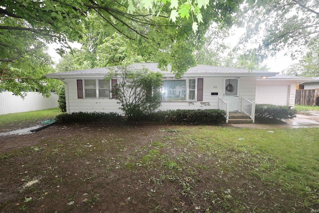 310 W Elm St, Millersburg, IN 46543 - single story home featuring a garage and concrete driveway