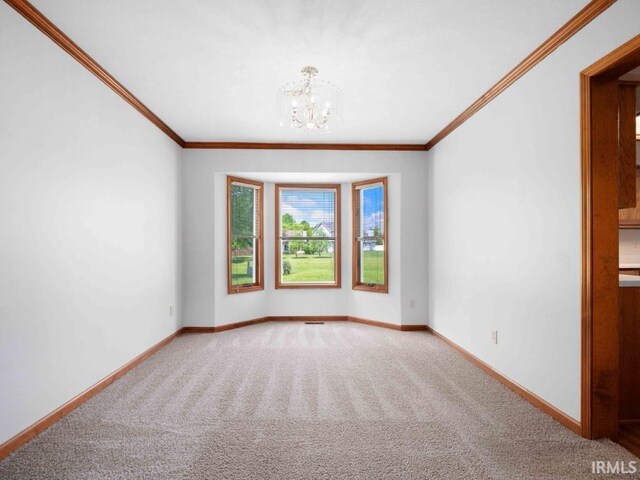 624 Diamond Point Pl, Fort Wayne, IN 46804 - empty room featuring a chandelier, carpet floors, and ornamental molding