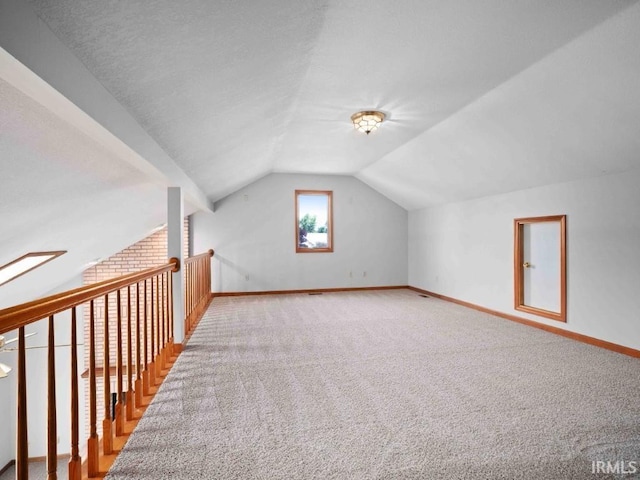 624 Diamond Point Pl, Fort Wayne, IN 46804 - additional living space featuring carpet flooring and lofted ceiling
